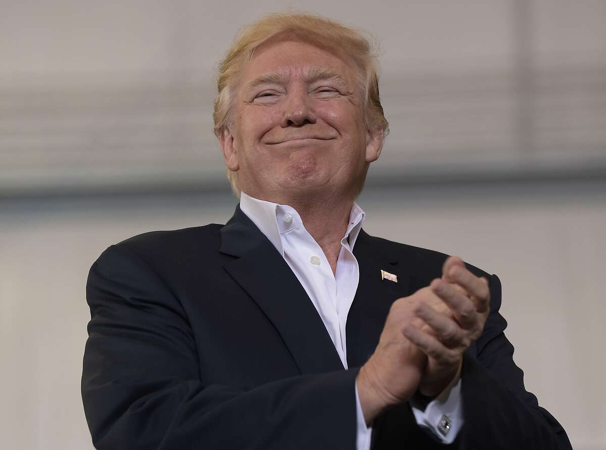 President Donald Trump smiles as he prepares to speak at his "Make America Great Again Rally" at Orlando-Melbourne International Airport in Melbourne, Fla., Saturday, Feb. 18, 2017. (AP Photo/Susan Walsh)
