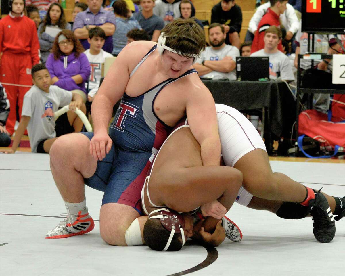 Reese Rusk of Tompkins won first place in the 285 pound weight class over Jalen McCuellar of Cy-Fair during the boys Region III 6-A UIL Wrestling Championships on Saturday February 18, 2017 at Tompkins HS, Katy, TX.