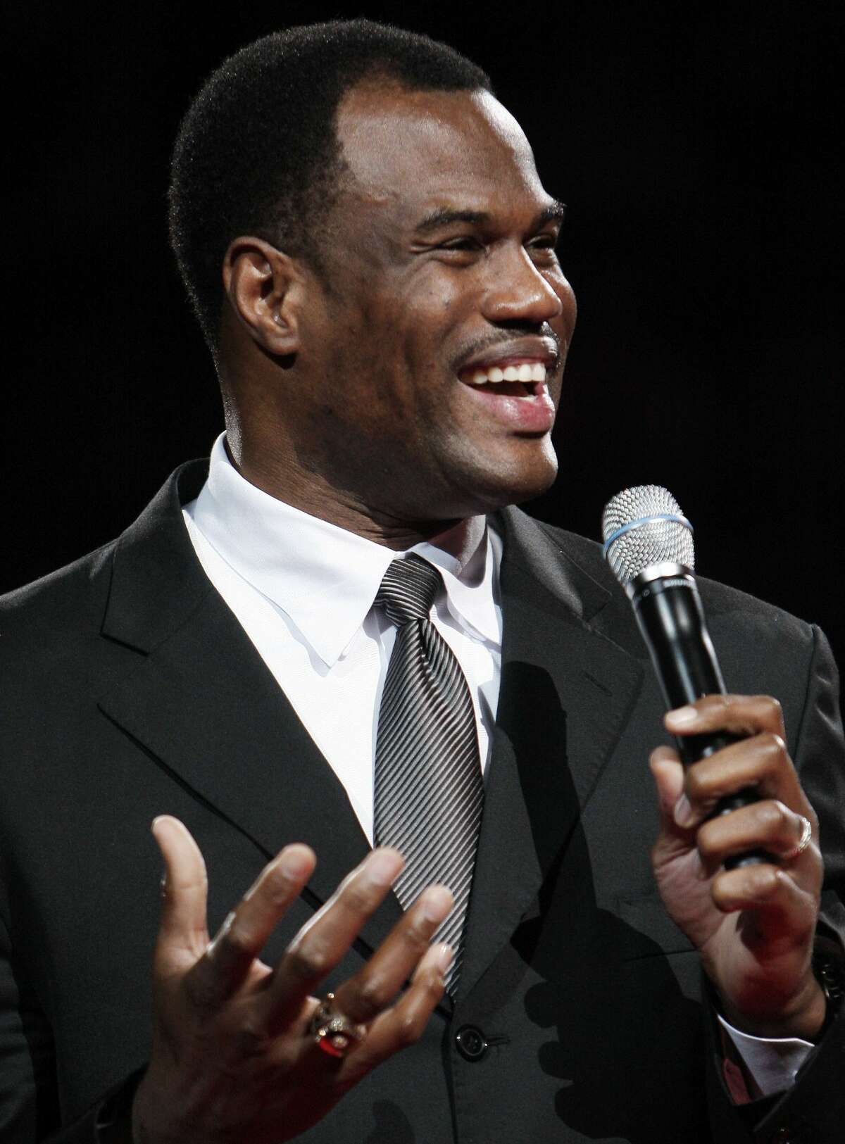 FILE - This Nov. 29, 2009 file photo shows former San Antonio Spurs player David Robinson addresing fans during a ceremony celebrating his induction into the Naismith Memorial Basketball Hall of Fame in San Antonio. Robinson will be among the speakers at a motivational business event in San Antonio.