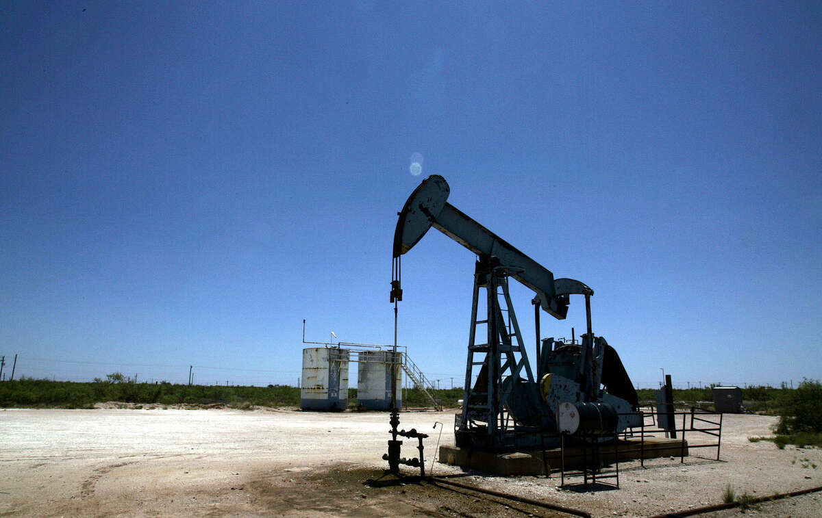 An oil pump works near Midland, Texas, Friday, July 14, 2006. The price of oil briefly surpassed $78 a barrel Friday and finished 4 percent higher for the week after Israeli attacks against Lebanese militants stoked fears of a wider Middle East conflict and possible oil-supply disruption. (AP Photo/LM Otero)