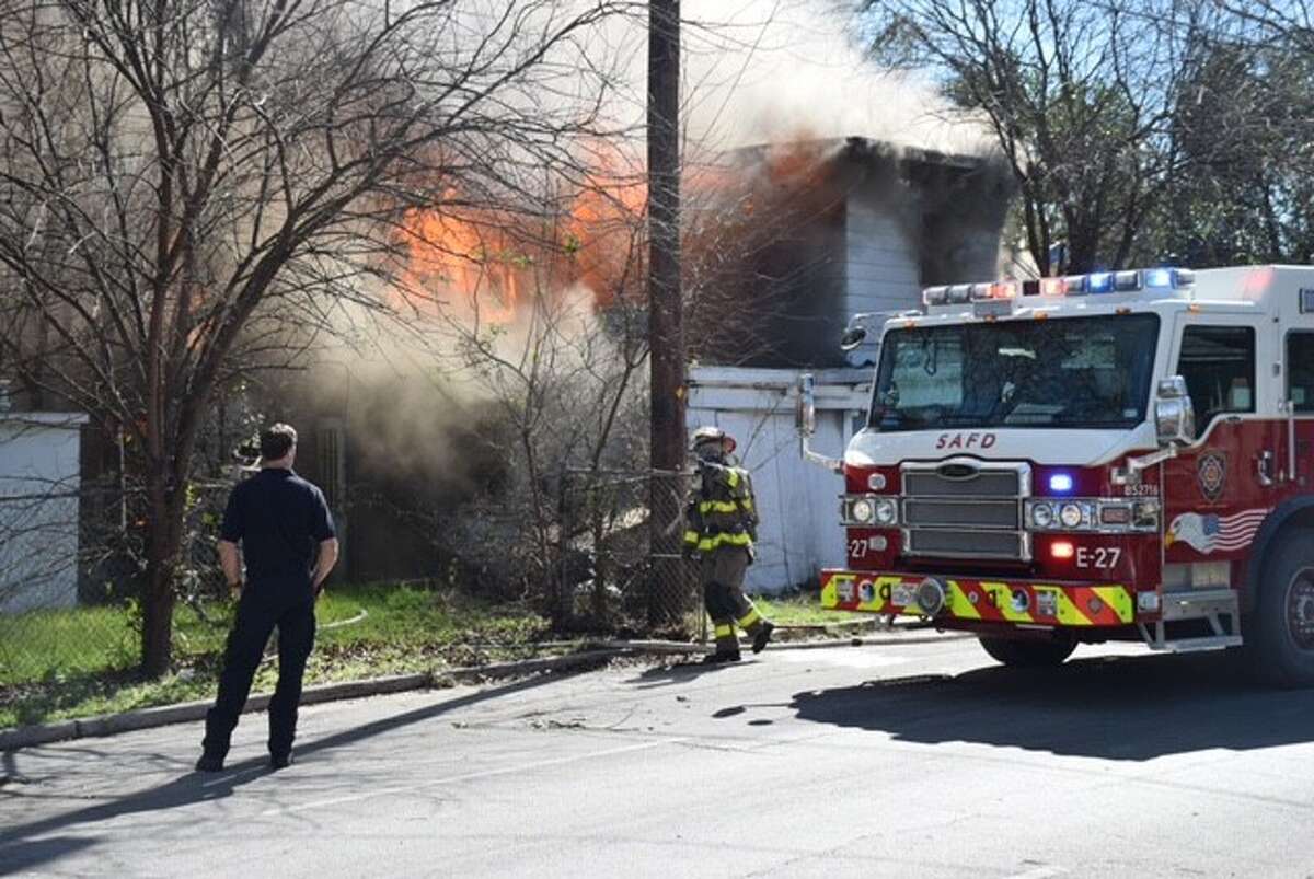 San Antonio firefighters respond to a blaze at a two-story home in the 2300 block of Fresno on Monday, Feb. 20, 2017.
