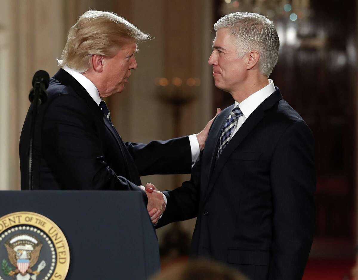 President Donald Trump shakes hands with Judge Neil Gorsuch, his choice for the Supreme Court. A reader does not regard the position as a “stolen seat” even though Republicans denied Merrick Garland, the man nominated by President Obama, from a hearing in the Senate.