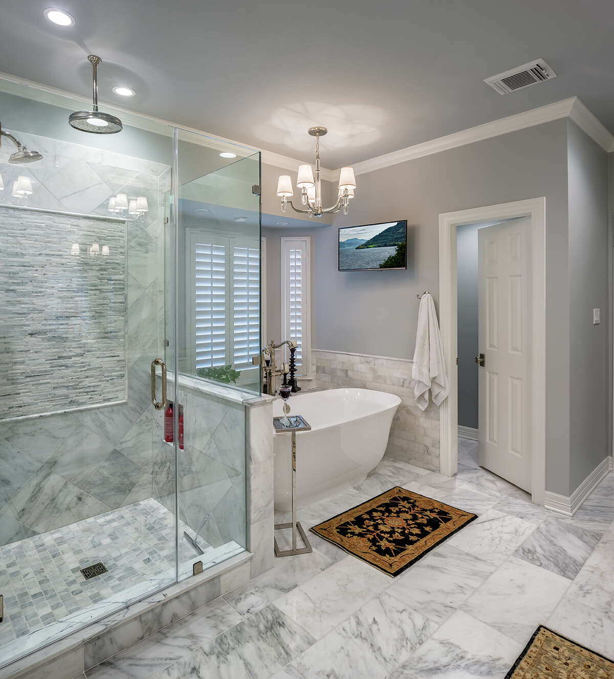In the master bathroom, the old garden tub was removed to make room for a sleeker freestanding bathtub.