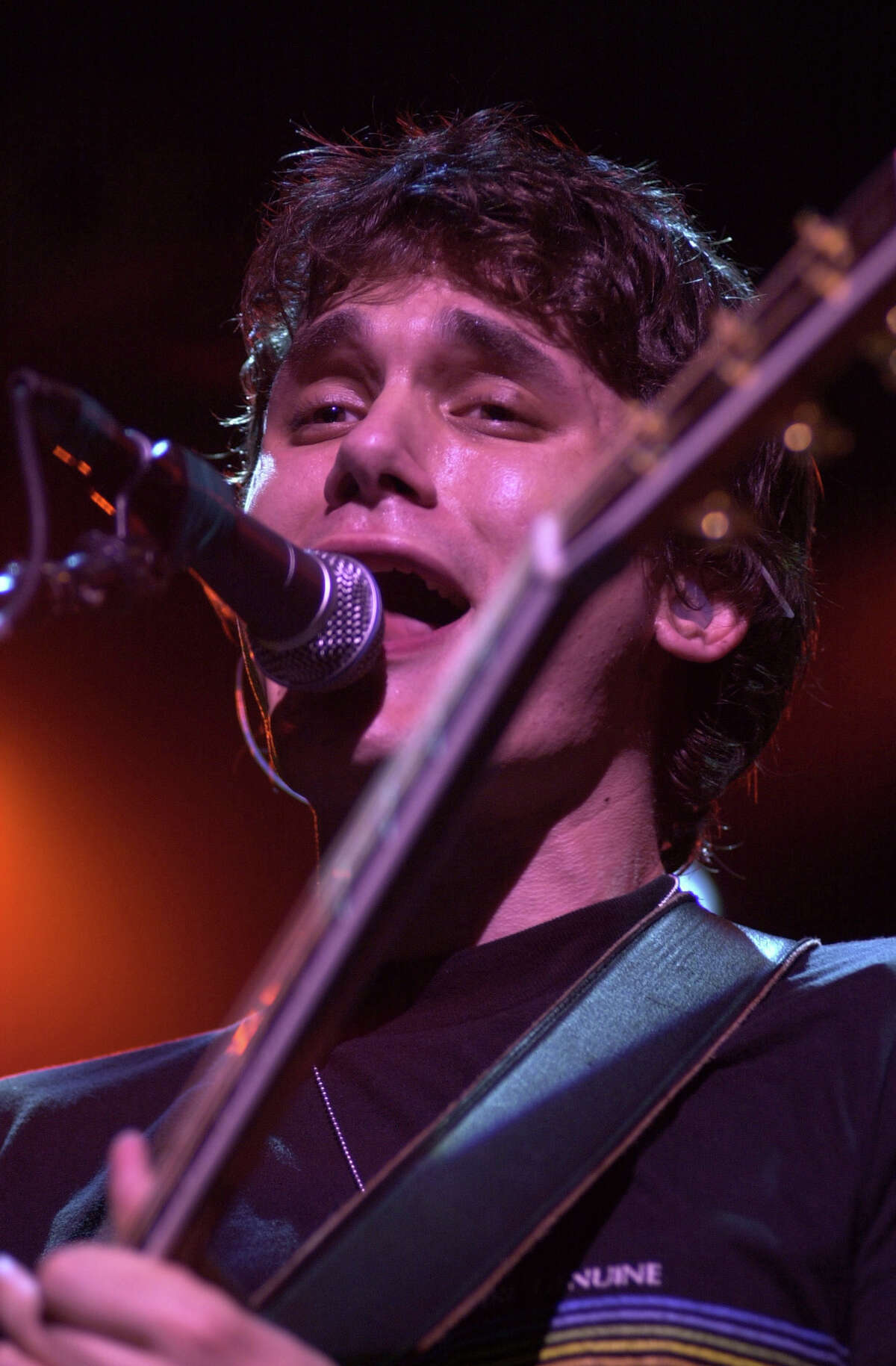 FILE PHOTO - 8/20/03, Pop singer John Mayer performs at the Meadows Music Center in Hartford on Wednesday night. His group headlined, while Counting Crows, and Stew opened the show.