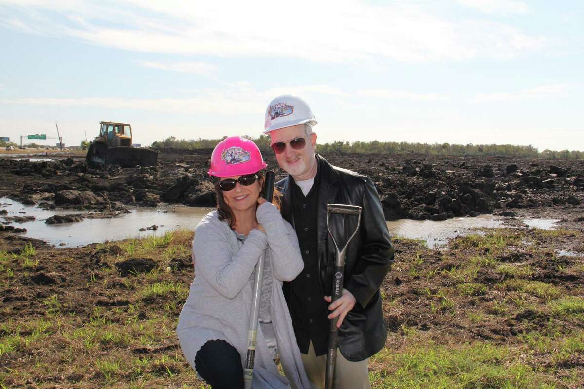 Dr. Harvey Slusky and his wife, Lisa, visit the site of the planned Adventure Pointe amusement park in Texas City. His family has as background in operating amusement parks and the miniature train at the Houston Zoo. Amusement parks are in my blood,â he says.
