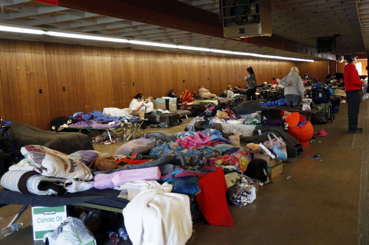 Evacuees from the Oroville Dam area are seen at a temporary shelter in the Silver Dollar Fairgrounds in Chico, California on February 14, 2017. A sheriff lifted a mandatory evacuation order in northern California, which had impacted nearly 200,000 people in an area under threat of catastrophic failure at the tallest dam in the United States. / AFP / MONICA DAVEY 