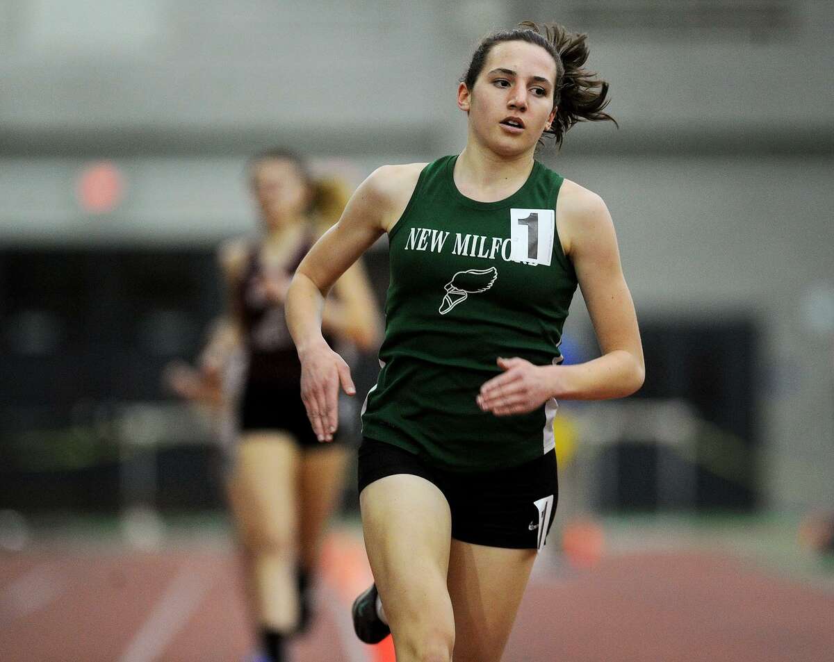 New Milford's Mia Nahom opens up a large lead on the way to an easy win in the 1600 meters at the CIAC State Championship Indoor Track & Field Meet at the Floyd Little Athletic Center in New Haven, Conn. on Monday, February 20, 2016.