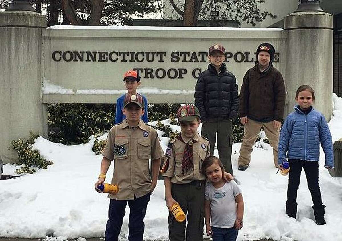 Members of the Webelos Scouts from Pack 20 Cos Cob recently got an inside look on what it takes to be a Connecticut state trooper by visiting the Troop G barracks in Bridgeport.