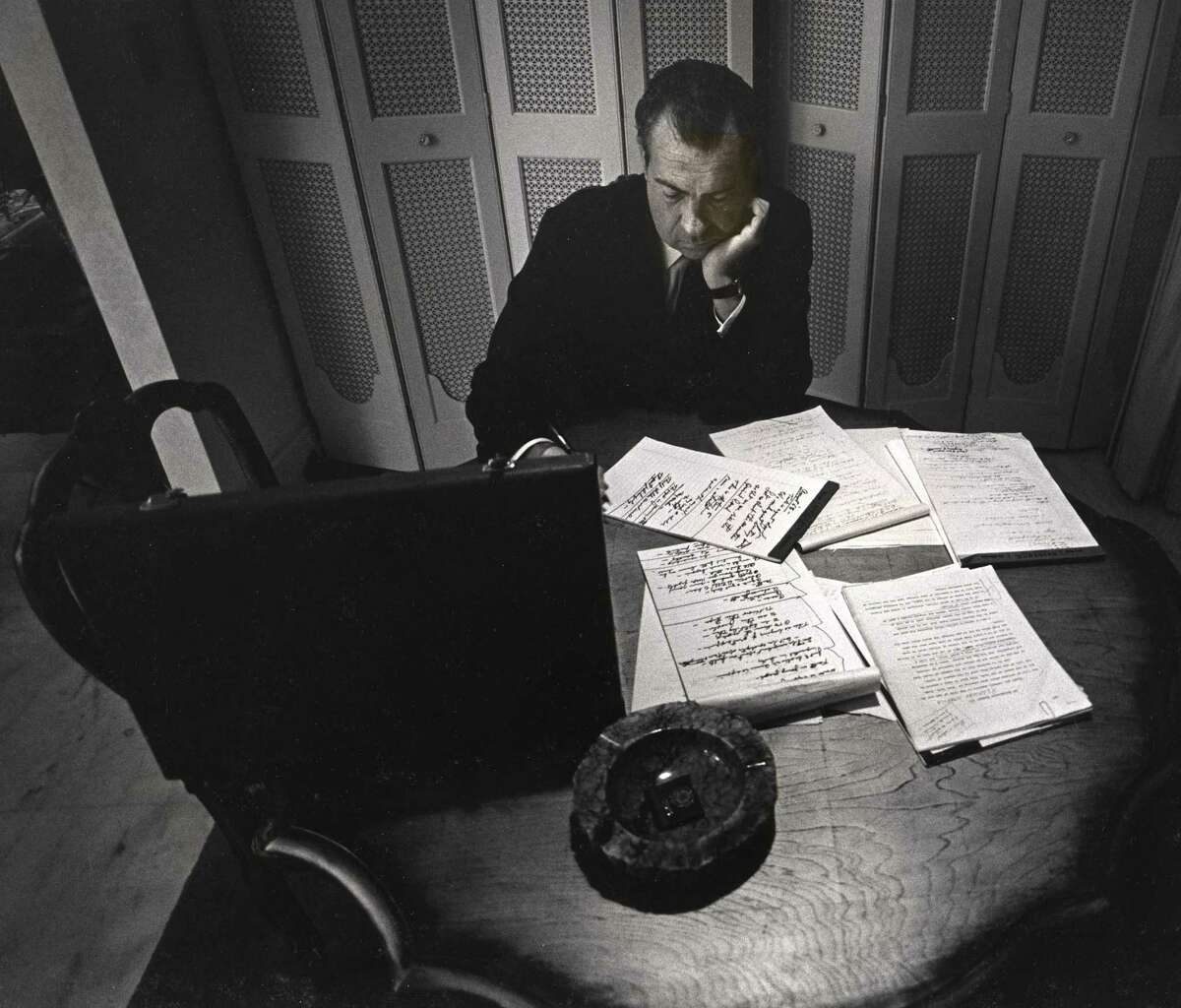 Alone in his hotel room, the presidential nominee Richard Nixon writes his acceptance speech, Republican National Convention, Miami Beach, 1968. David Douglas Duncan (American, b. 1916). Gelatin silver print, 8 13/16 x 13 7/16 inches.