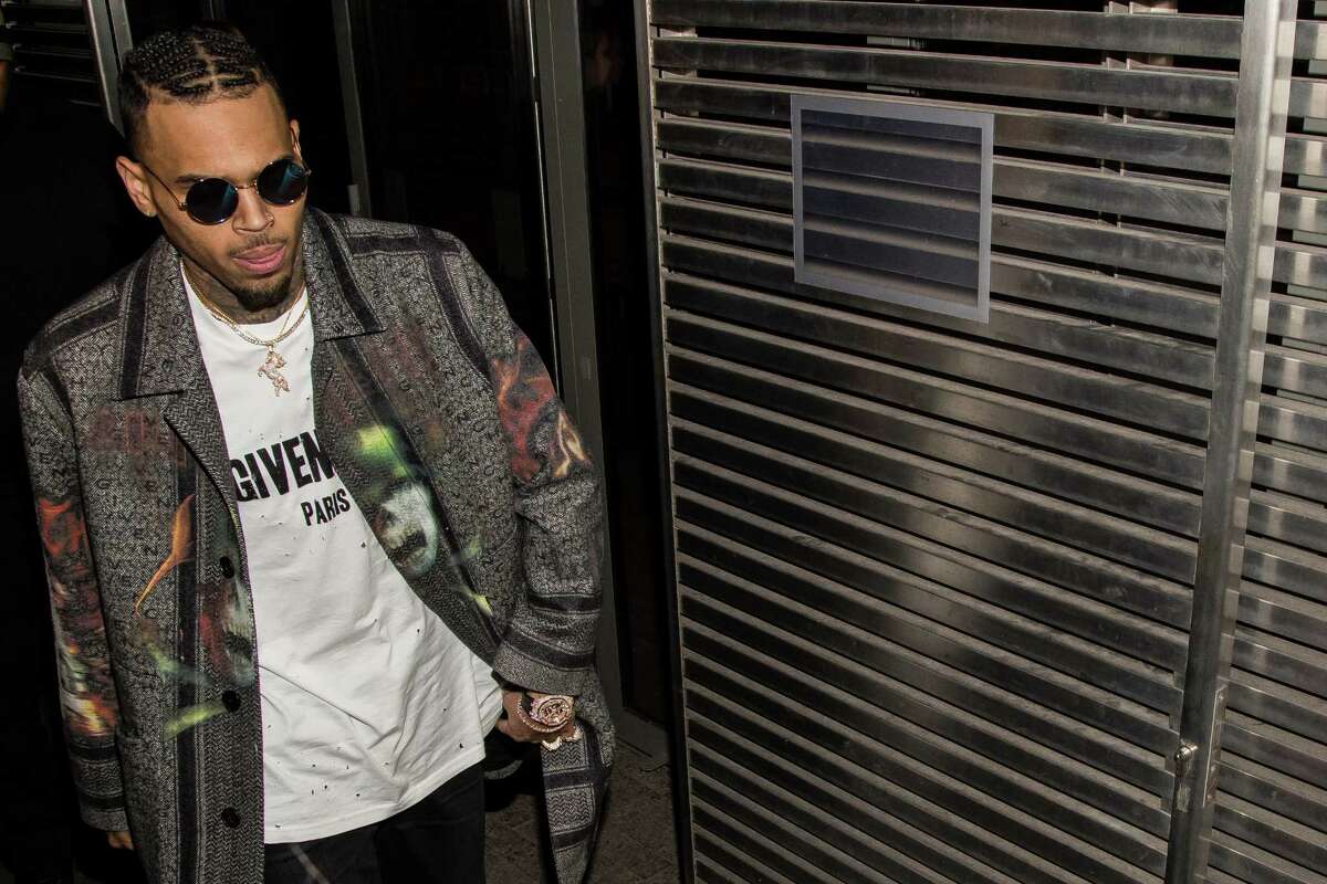 American singer Chris Brown arrives at the Givenchy Fall-winter 2016-2017 ready to wear fashion collection presentation on Sunday, March 6, 2016 in Paris.