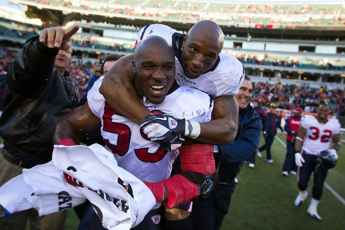 Houston Texans inside linebacker DeMeco Ryans (59) celebrates with free safety Danieal Manning (38) after defeating the Cincinnati Bengals at Paul Brown Stadium on Sunday, Dec. 11, 2011, in Cincinnati. The Texans rallied to score in the final minute of the game for a 20-19 victory over the Bengals. ( Smiley N. Pool / Houston Chronicle )