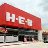 A car passes by the new H-E-B on Tuesday. The new H-E-B location on College Street held a preview of their new store for the media and VIPs on Tuesday. The 56,000 square foot store will open to the public at 6 a.m. Wednesday. Photo taken Tuesday 5/26/15 Jake Daniels/The Enterprise
