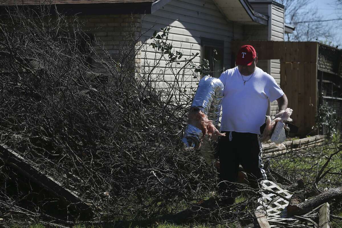 Clean up efforts continue Tuesday February 21, 2017 on Linda street after tornados swept through north central San Antonio late Sunday night.
