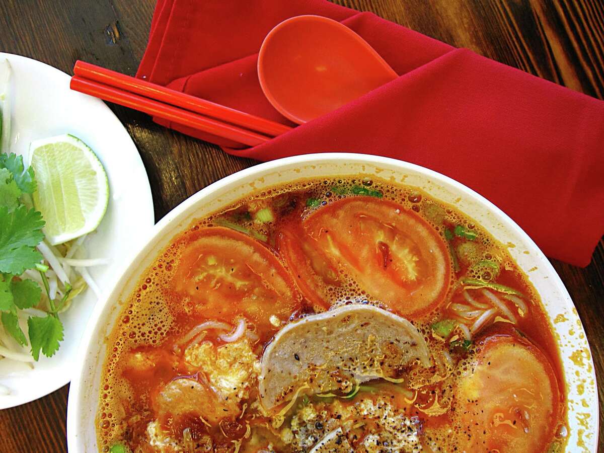 A tomato-laced noodle soup called bún riêu, seasoned with crumbled cakes of egg, dried shrimp and crab paste, from Berni Vietnamese Restaurant.