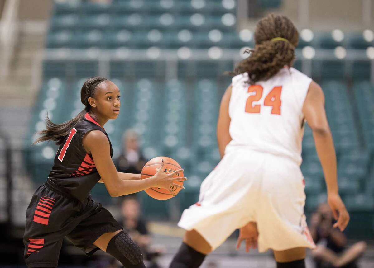 Dyani Robinson (21) of the Langham Creek Lobos looks to pass the ball against the Seven Lakes Spartans in Girls High School Basketball Playoffs on Tuesday, February 21, 2017 at the Merrell Center in Katy, Texas.