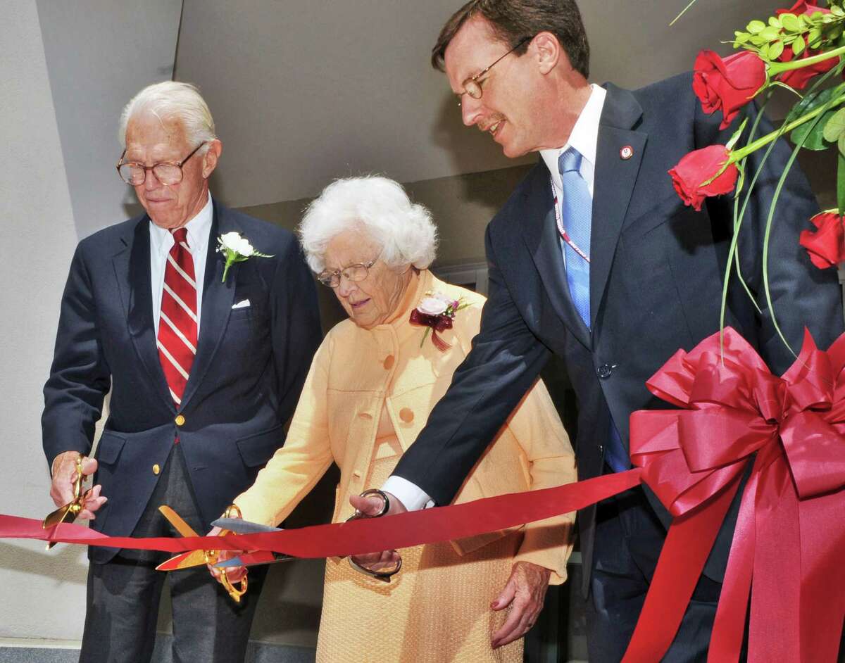 John S. Wold, left, Class of '38, his wife, Jane, and and Union College President Stephen C. Ainlay cut a ribbon opening Union's Peter Irving Wold Center, a $22 million, three-story, 35,000-square-foot building housing interdisciplinary research facilities, classroom space and an advanced computing lab Saturday afternoon May 21, 2011. (John Carl D'Annibale / Times Union)