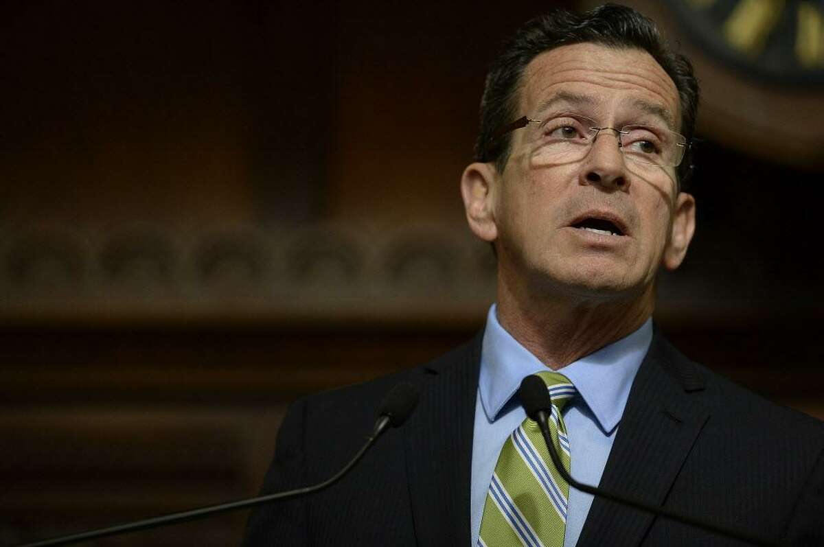 FILE — Connecticut Gov. Dannel P. Malloy delivers his budget address to members of the house and senate inside the Hall of the House at the state Capitol in Hartford, Conn., Wednesday, Feb. 8, 2017. (AP Photo/Jessica Hill)