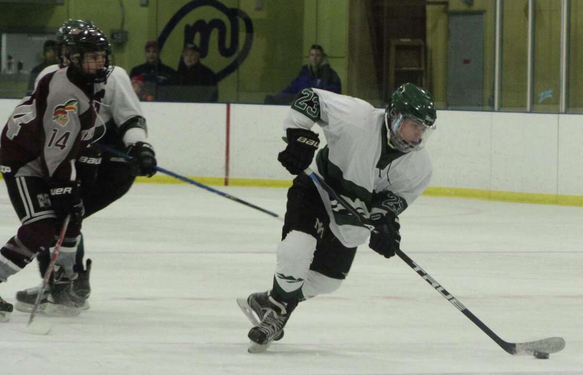 New Milford hockey battles its way into postseason