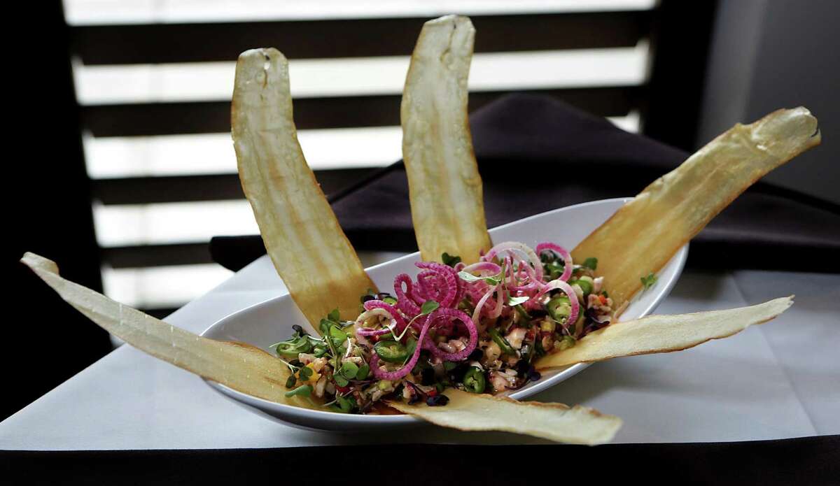 The octopus ceviche with strips of fried yuca