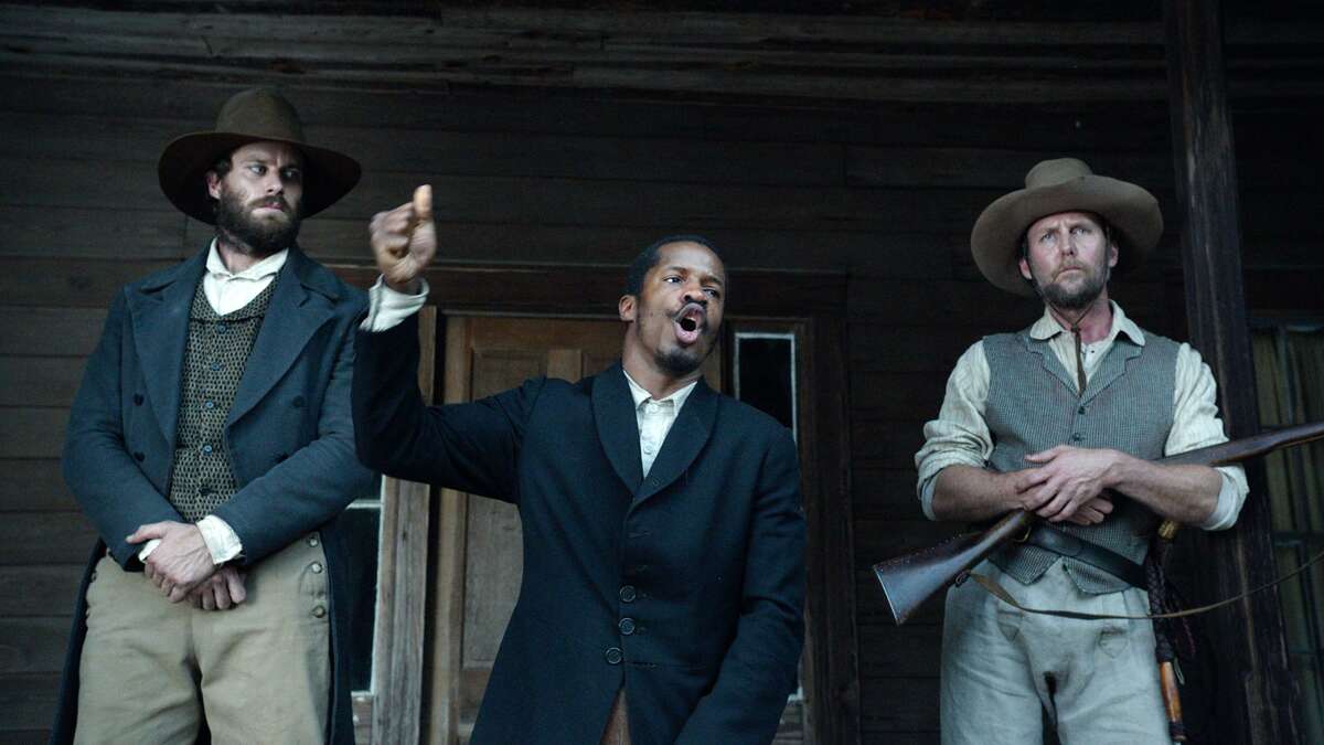 In this image released by Fox Searchlight Pictures, from left, Armie Hammer portrays Samuel Turner, Nate Parker portrays Nat Turner and Jayson Warner Smith portrays Earl Fowler in a scene from "The Birth of a Nation." (Fox Searchlight Pictures via AP)