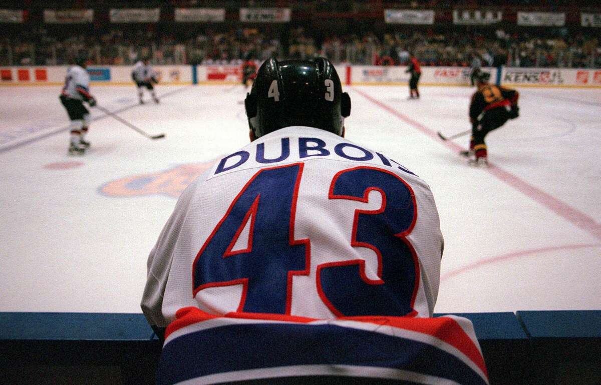 San Antonio Iguana Jonathon Dubois (43) watches his team battle the Oklahoma City Blazers January 13, 2001 from the penalty box after Dubois got into a fight. Dubois wasted no time in heckling the referees as they would skate by.