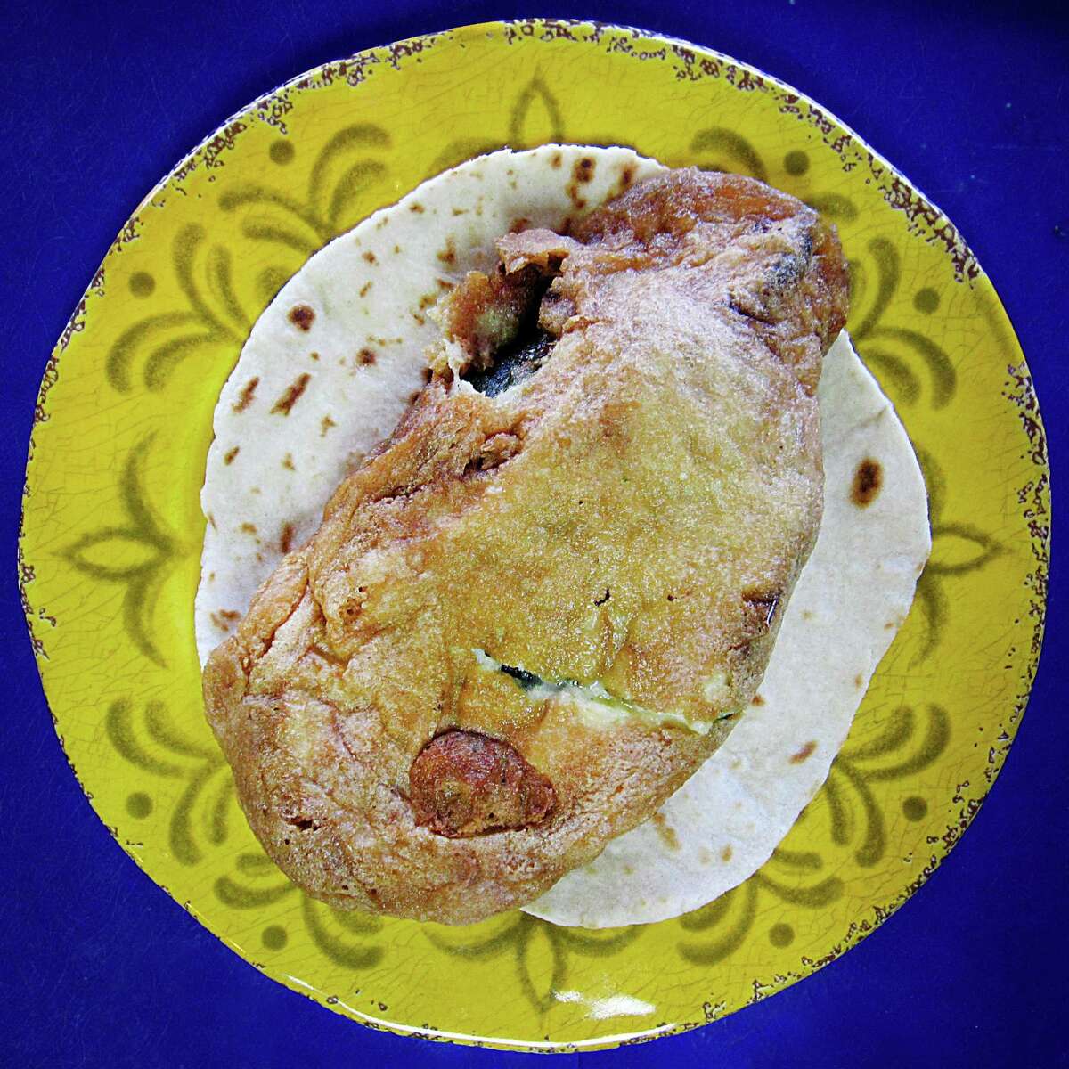 Chile relleno with cheese taco on a handmade flour tortilla from Tacos Martinez on West Commerce Street.