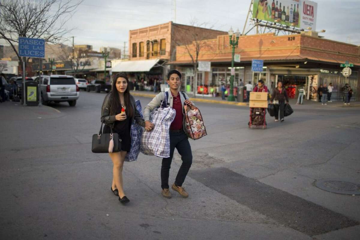 Valerie Padilla and Diego Munoz, both 16, cross from El Paso into Ciudad Juarez for the weekend to see relatives. MUST CREDIT: Photo by Ivan Pierre Aguirre for The Washington Post