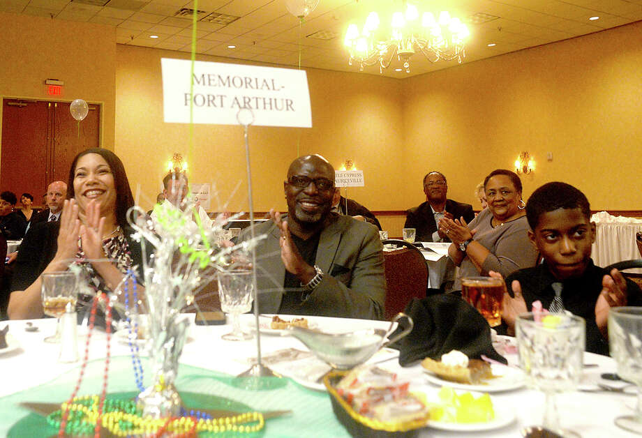 Kary Vincent Jr.'s family, including step-mother Angela Vincent, father Kary Vincent, Sr., and brother Kyler Vincent, 11, applaud after he makes his comments having been named defensive player winner during the annual Willie Ray Smith Awards ceremony Wednesday night at the MCM Elegante Hotel. The region's top offensive and defensive players were honored at the event, which is sponsored by the Beaumont Founders Lions Club and in its 25th year. Photo taken Wednesday, February 22, 2017 Kim Brent/The Enterprise Photo: Kim Brent