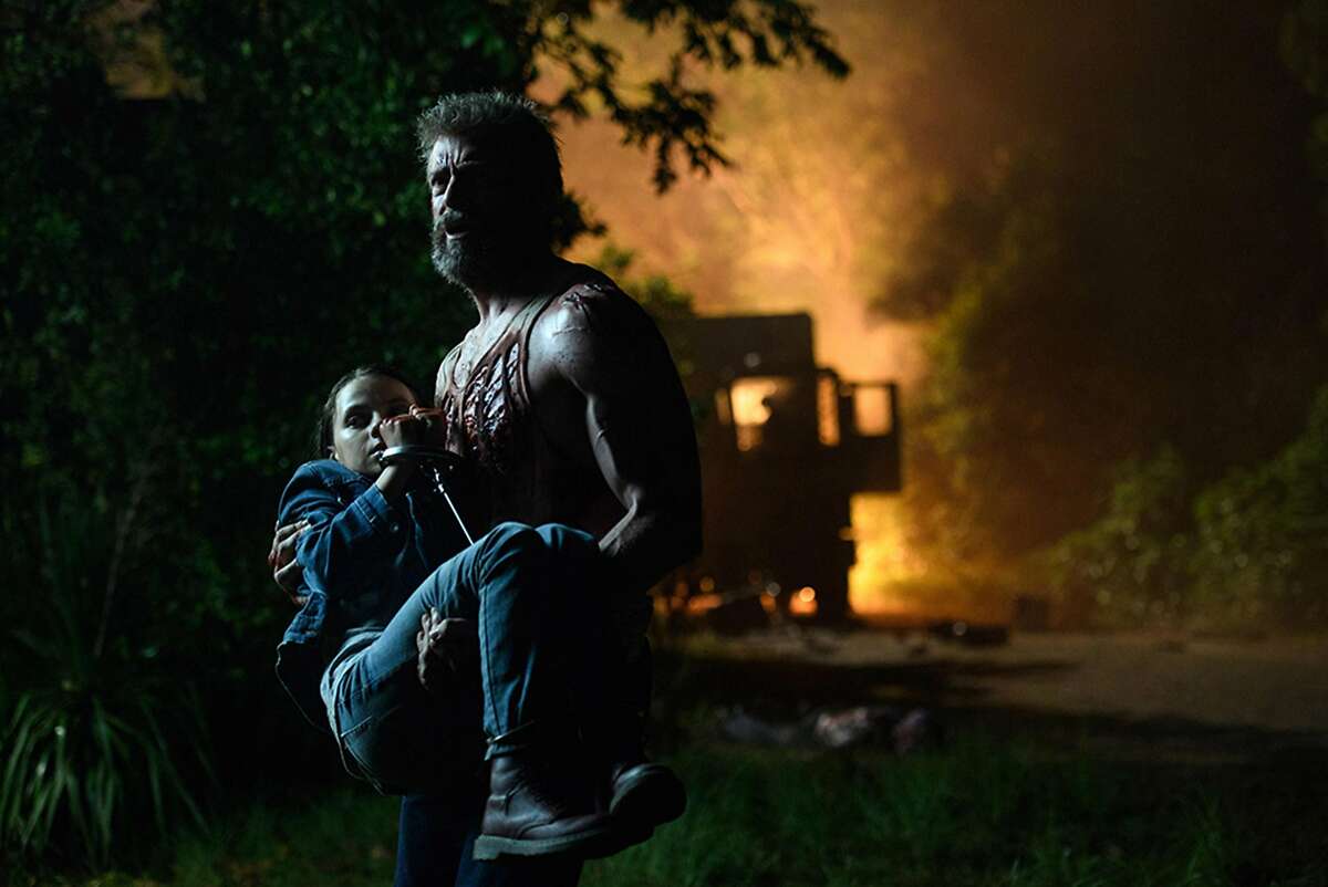 Logan/Wolverine (Hugh Jackman) tries to protect the young mutant Laura (Dafne Keen) in "Logan." (Ben Rothstein)