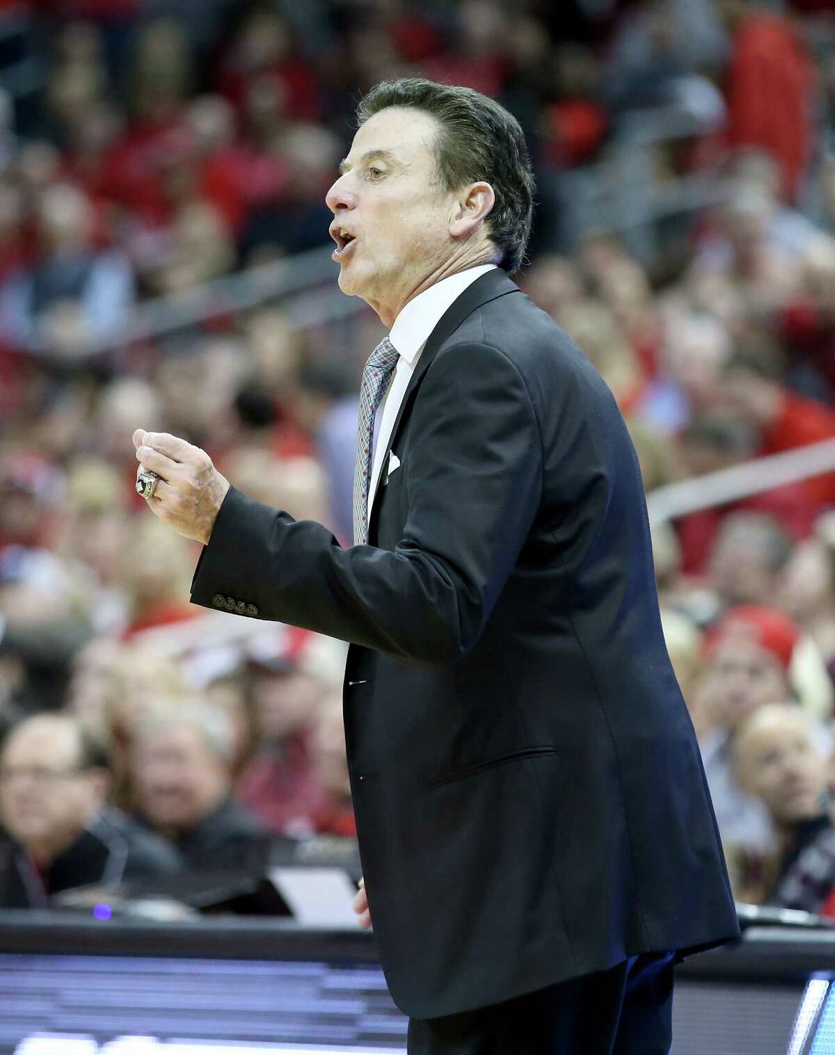LOUISVILLE, KY - FEBRUARY 18: Rick Pitino stands the head coach of the Louisville Cardinals gives instructions to his team the game against the Virginia Tech Hokies at KFC YUM! Center on February 18, 2017 in Louisville, Kentucky.