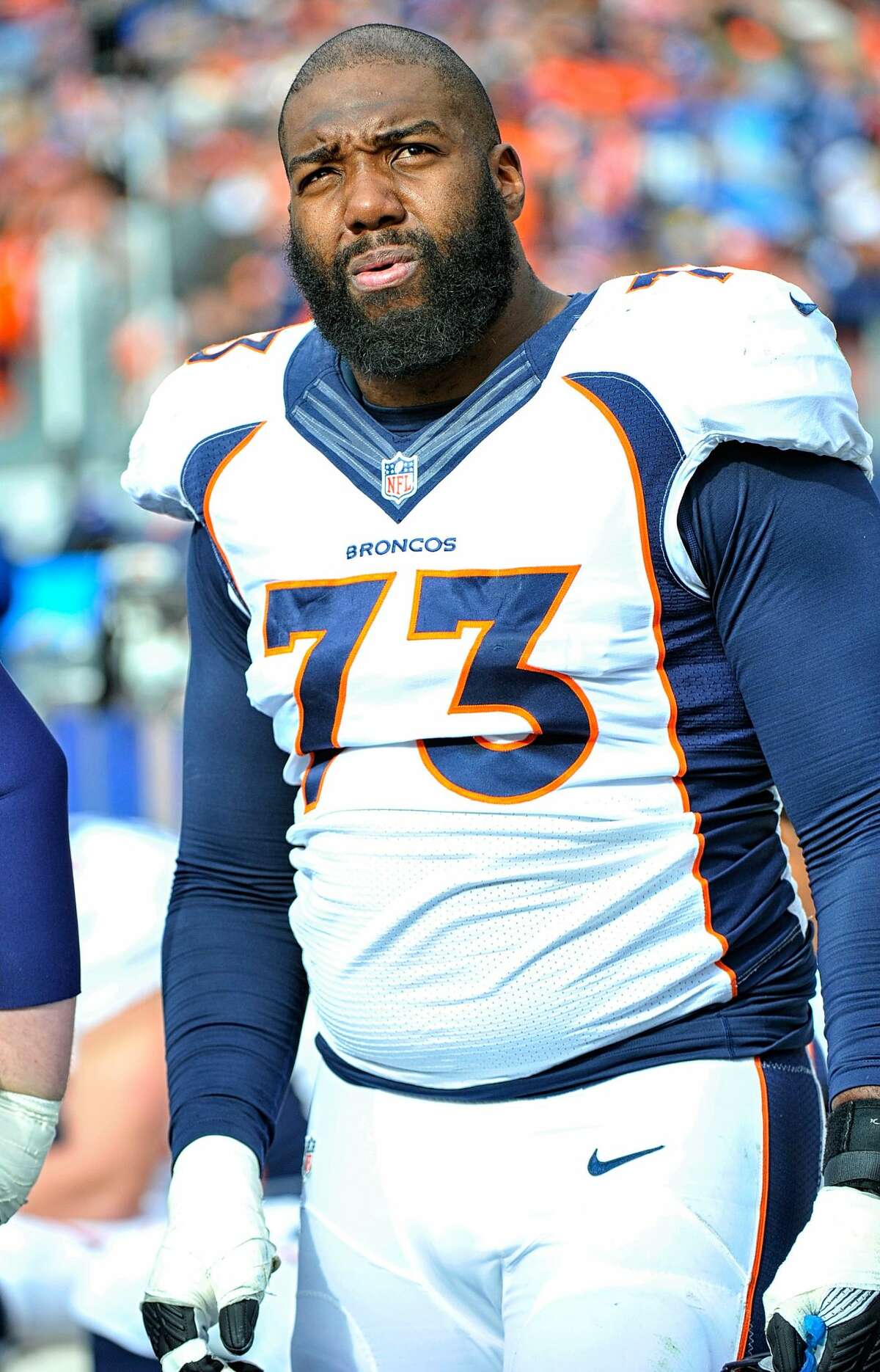 Russell Okung of the Denver Broncos watches from the sideline during a game against the Tennessee Titans at Nissan Stadium on December 11, 2016 in Nashville, Tennessee. (Photo by Frederick Breedon/Getty Images)