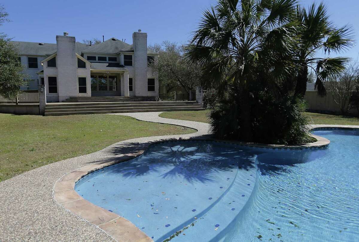 The backyard pool view of a home that was auctioned by the federal government on Thursday, Feb. 23, 2017 that belonged to the mother-in-law of former Coahuila gov. Humberto Moreira. The home Greystone home was sold to the highest bidder for $515,000. (Kin Man Hui/San Antonio Express-News)