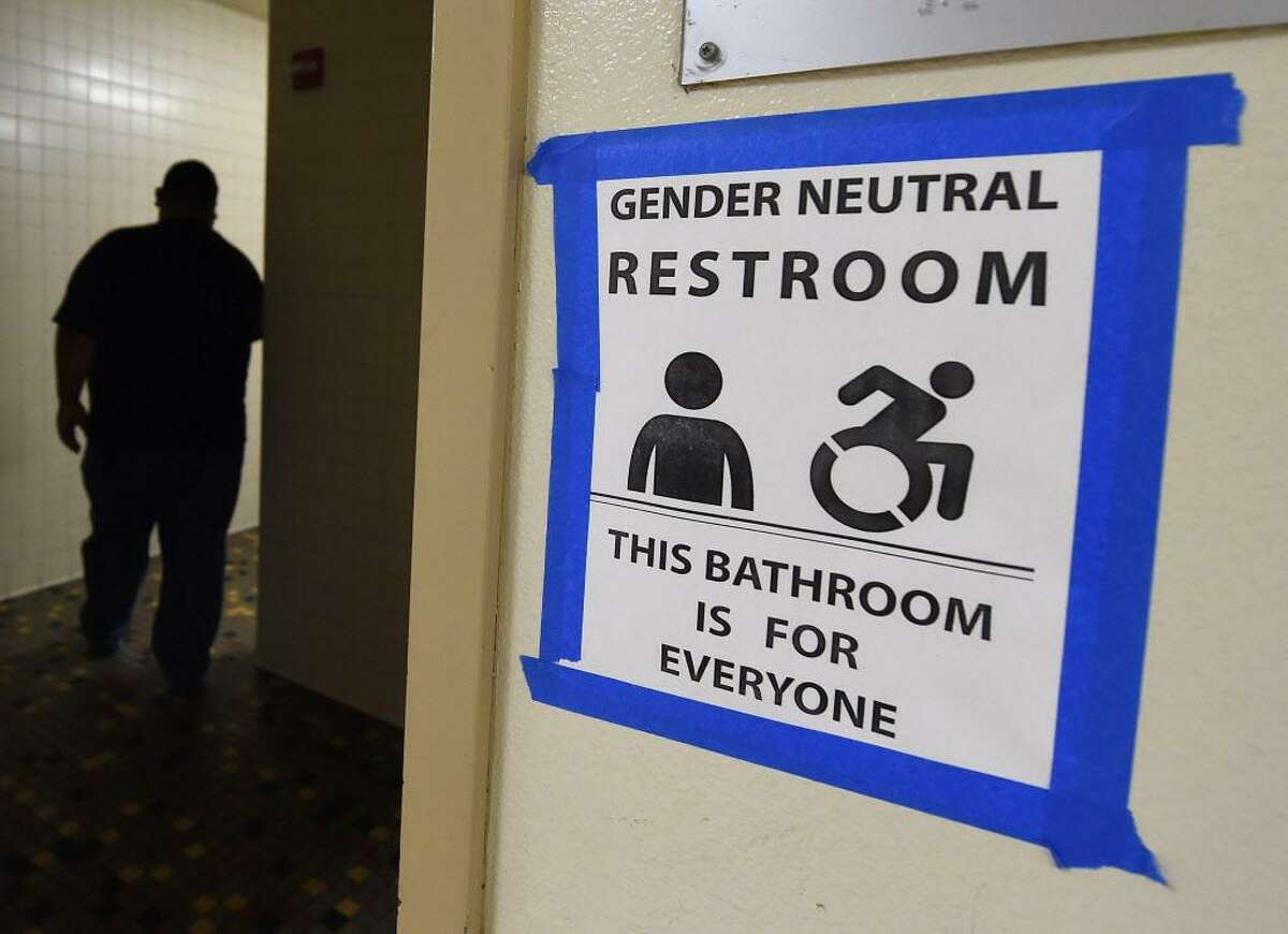 A sign posted outside the Santee High School's gender neutral restrooms at their campus in Los Angeles on May 4, 2016. The White House on February 22, 2017, overturned protections for transgender students that required public schools to allow them to use bathrooms and locker rooms matching the gender with which they identify. With the move, US President Donald Trump -- who indicated during his campaign that he might protect LGBT rights -- has sided with social conservatives on a key issue at the center of a broader cultural battle between conservatives and liberals.