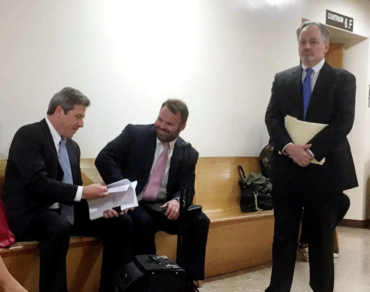 Republican Town Committee Attorney Jim Baldwin, left, Selectman Chris Tymniak and Selectman Ed Bateson wait outside the Bridgeport Superior Court on Thursday, Feb. 23 for the hearing on Fairfield's special election.