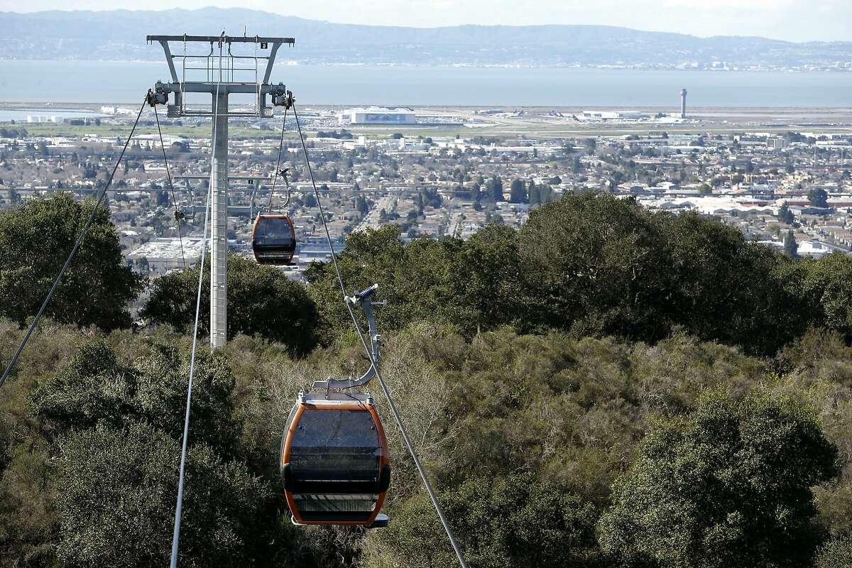 Cabins are installed on the cable of a gondola system that will carry visitors to the Oakland Zoo's new California Trail exhibit in Oakland, Calif. on Thursday, Feb. 23, 2017. The gondola and restaurant, with a sweeping view of the Bay Area, is scheduled to open in June of this year with the entire exhibit inhabited with native California creatures slated to open in 2018.
