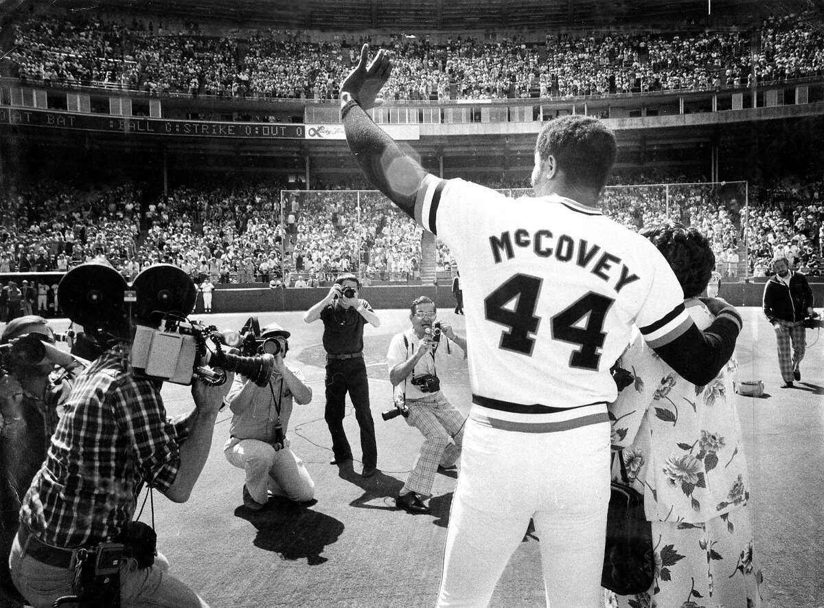 Sept. 18, 1977: Giants first baseman Willie McCovey waves to fans as he's honored at Candlestick Park in 1977. His arm is around his mother Esther's shoulder.