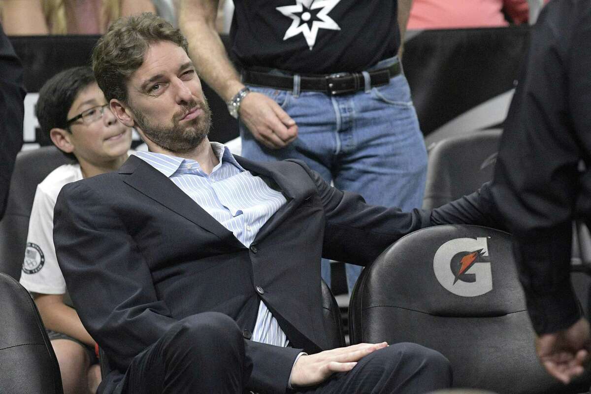 San Antonio Spurs center Pau Gasol watches from the bench during the second half of an NBA basketball game against the Orlando Magic in Orlando, Fla., Wednesday, Feb. 15, 2017. The Spurs won 107-79. (AP Photo/Phelan M. Ebenhack)