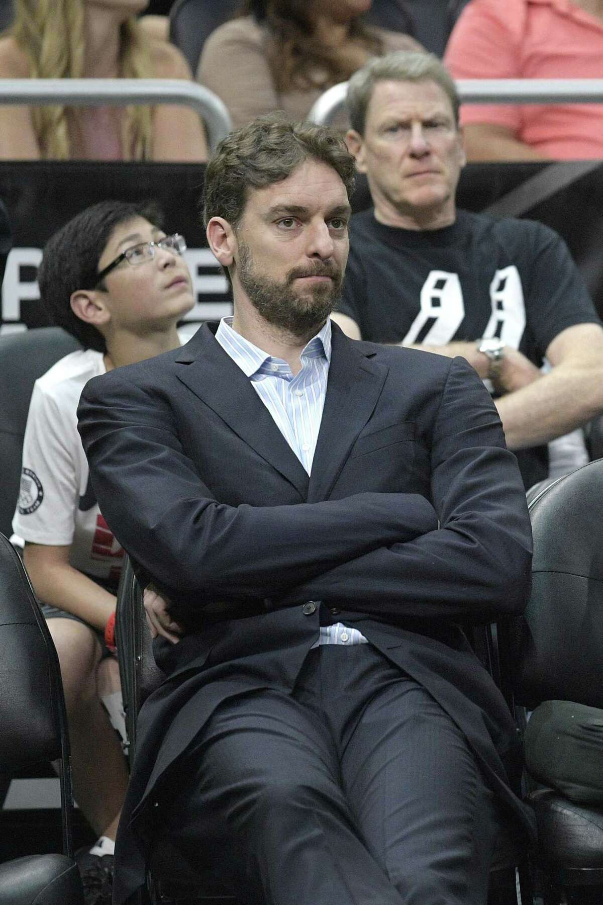 San Antonio Spurs center Pau Gasol watches from the bench during the second half of an NBA basketball game against the Orlando Magic in Orlando, Fla., Wednesday, Feb. 15, 2017. The Spurs won 107-79. (AP Photo/Phelan M. Ebenhack)