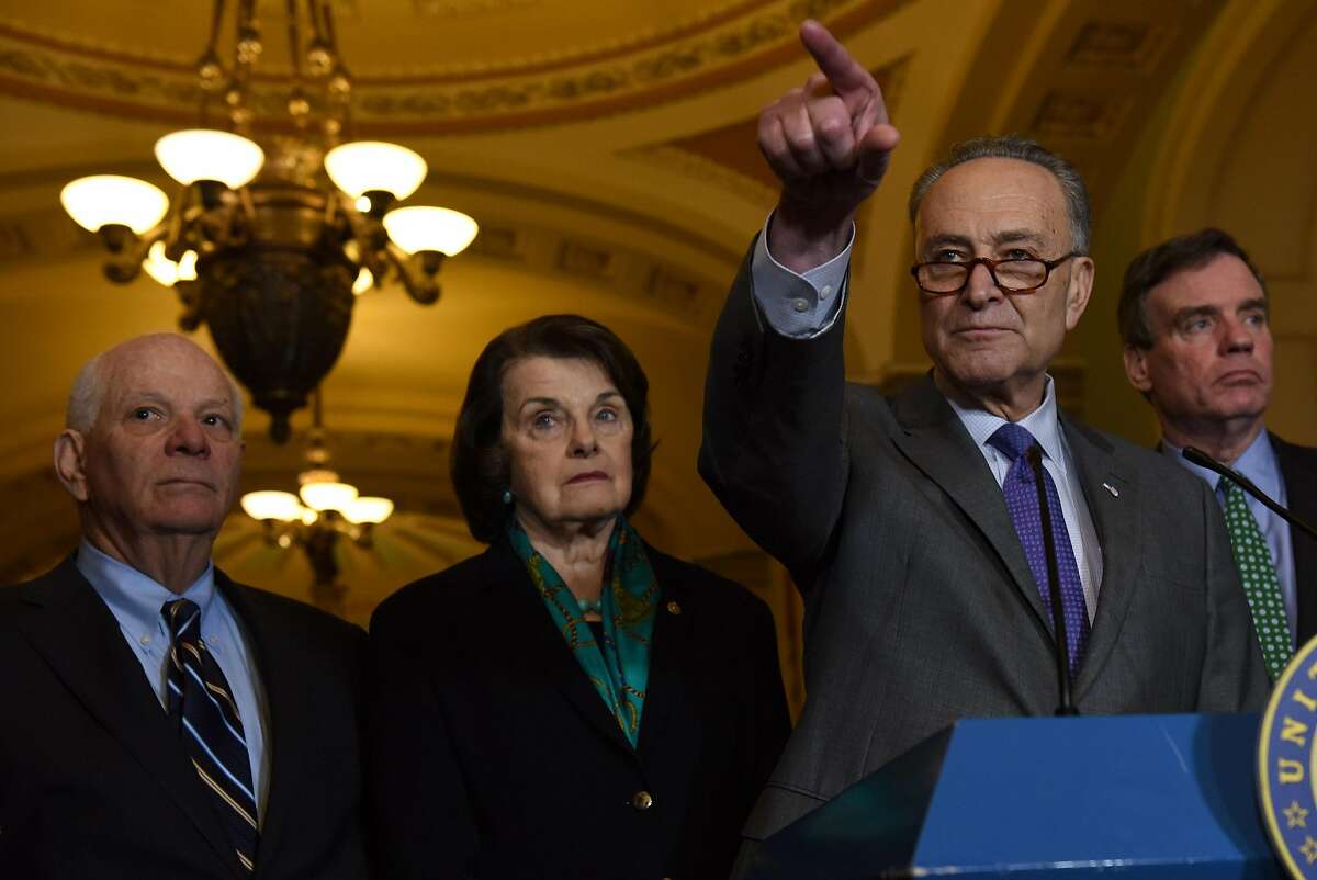Senate Minority Leader Chuck Schumer, D-N.Y., holds a news conference with from left, Sens. Ben Cardin, D-Md., Dianne Feinstein, D-Calif., and Mark R. Warner, D-Va. MUST CREDIT: Washington Post photo by Michael Robinson Chavez