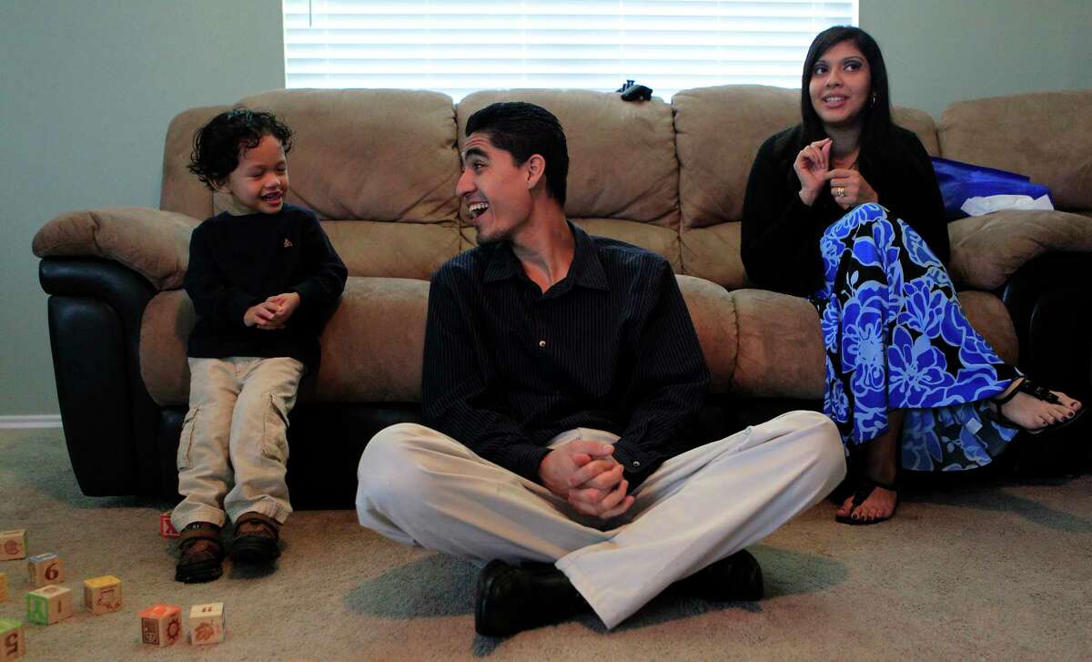 Jose Escobar﻿ ﻿shares a laugh with his son, Walter, ﻿and wife, Rose ﻿Escobar﻿, at their south Houston home ﻿in January 2012. At that time, he just survived a scare with immigration authorities. ﻿