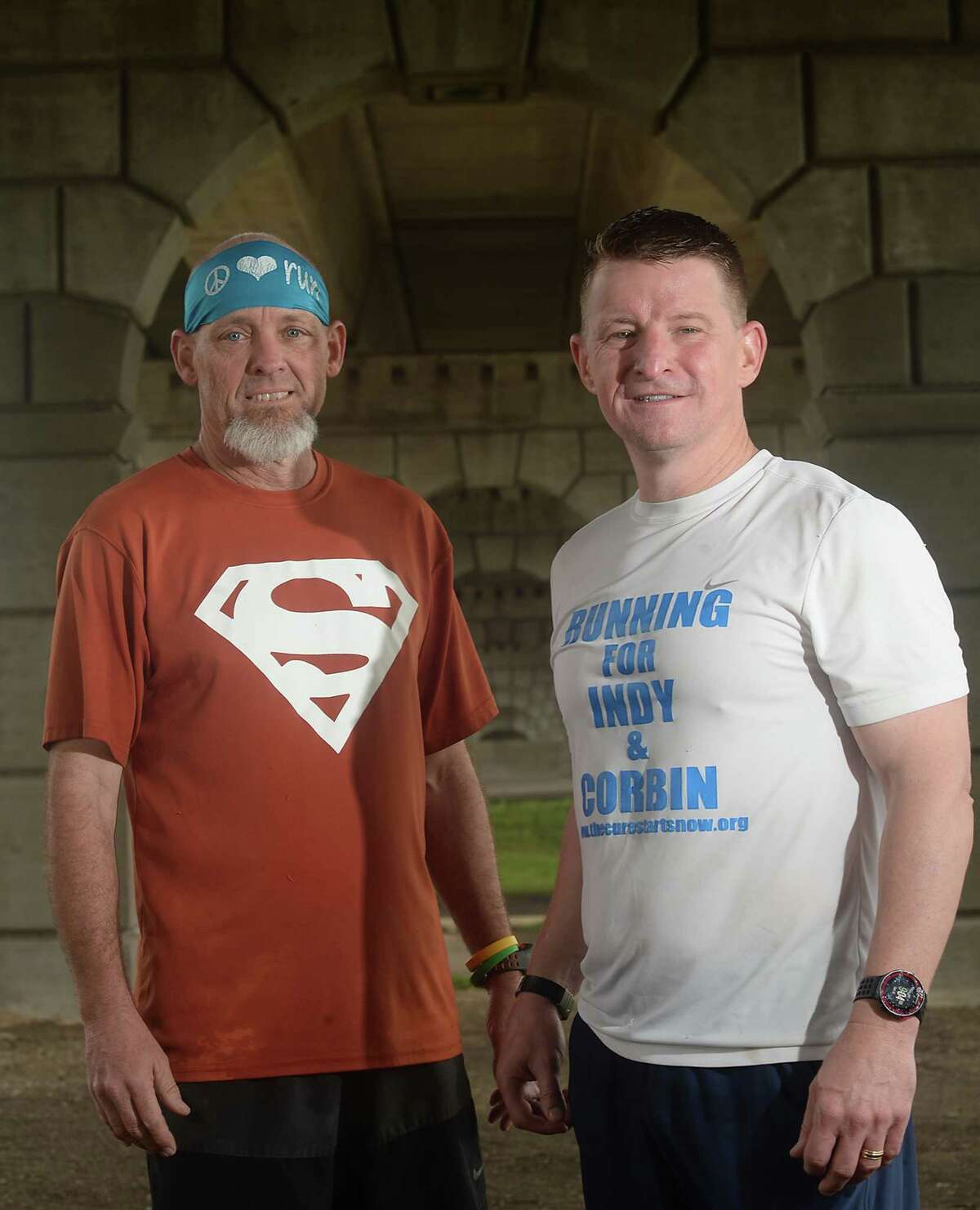 Runners Ike Adams (left) and Dave Jones are both in training for this year's Gusher Marathon. The pair will team up again later this spring when they head north to take part in the Boston Marathon. Adams and Jones are pairing their love of running with a cause near and dear to their hearts, "Running for a Purpose" to raise funds for The Cure Starts Now Foundation. Photo taken Saturday, February 18, 2017 Kim Brent/The Enterprise