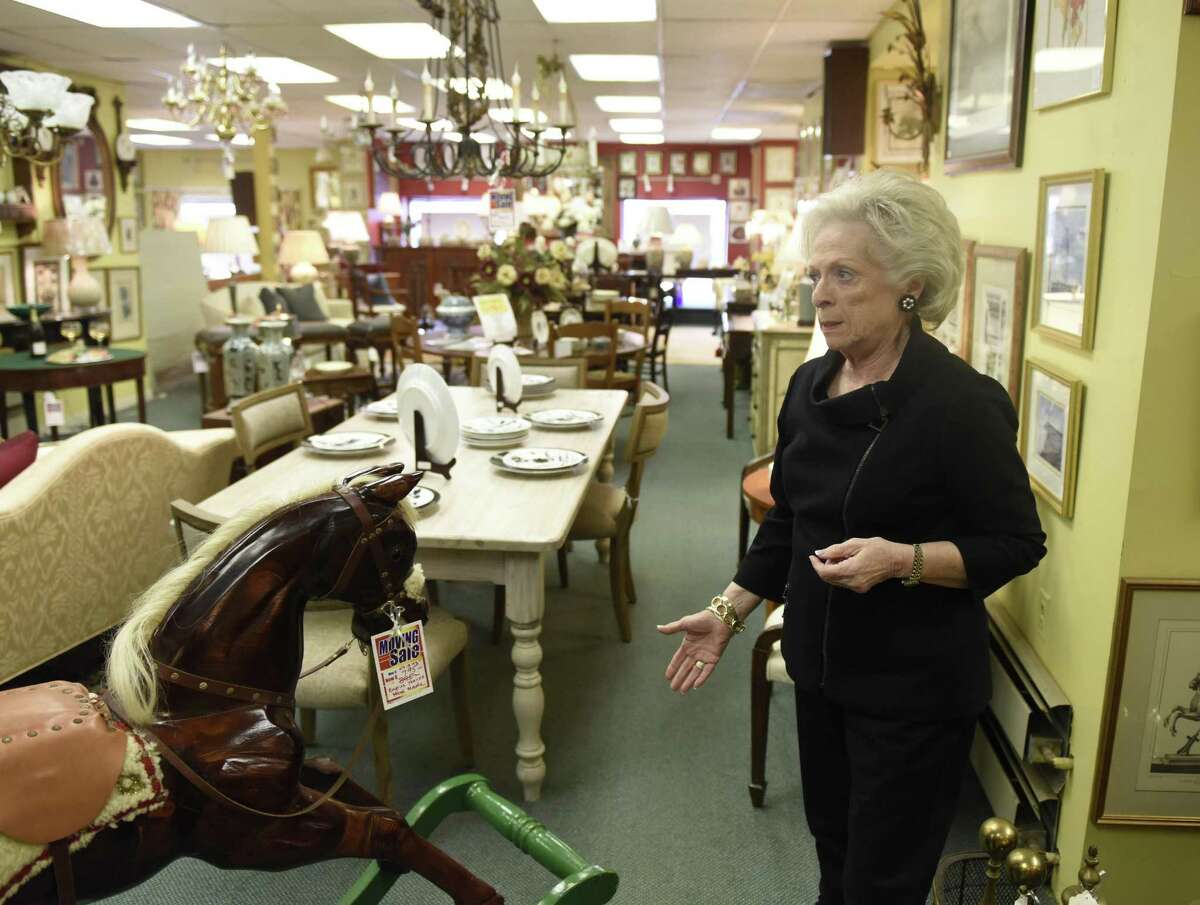 Owner Harriet Roughan shows items for sale in her consignment store, Estate Treasures, in Old Greenwich. Click through the slideshow to see the top 10 things people can do to declutter their lives. 