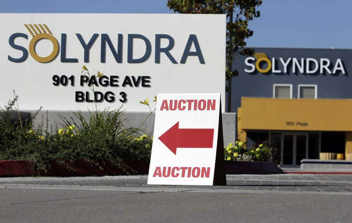 FILE - In this Oct. 31, 2011 file photo, an auction sign sits on a curb outside bankrupt Solyndra headquarters in Fremont, Calif. When it was established in 2009, as part of President Barack Obama?’s stimulus package, the clean energy loan program was billed as being able to create jobs and promote environmentally friendly energy. Instead, it became synonymous with failure and a regular talking point for conservatives. But roughly six years on in Hugoton, Kansas and elsewhere, there are signs the program is working. (AP Photo/Paul Sakuma, File)