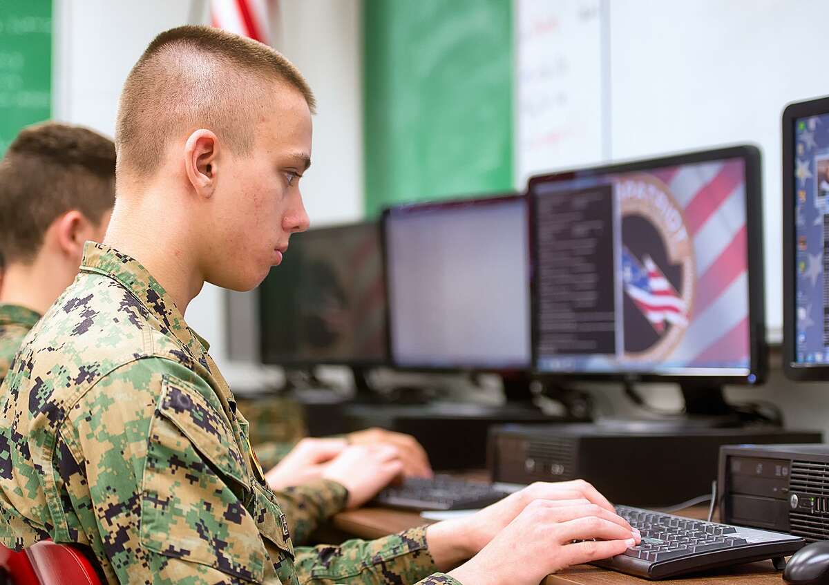 In this photo taken March 10, 2015, George Zenner, team captain of the Marine Military Academy CyberPatriot team, practices his security skills before the competition this week in Harlingen, Texas. (AP Photo/Valley Morning Star, David Pike)