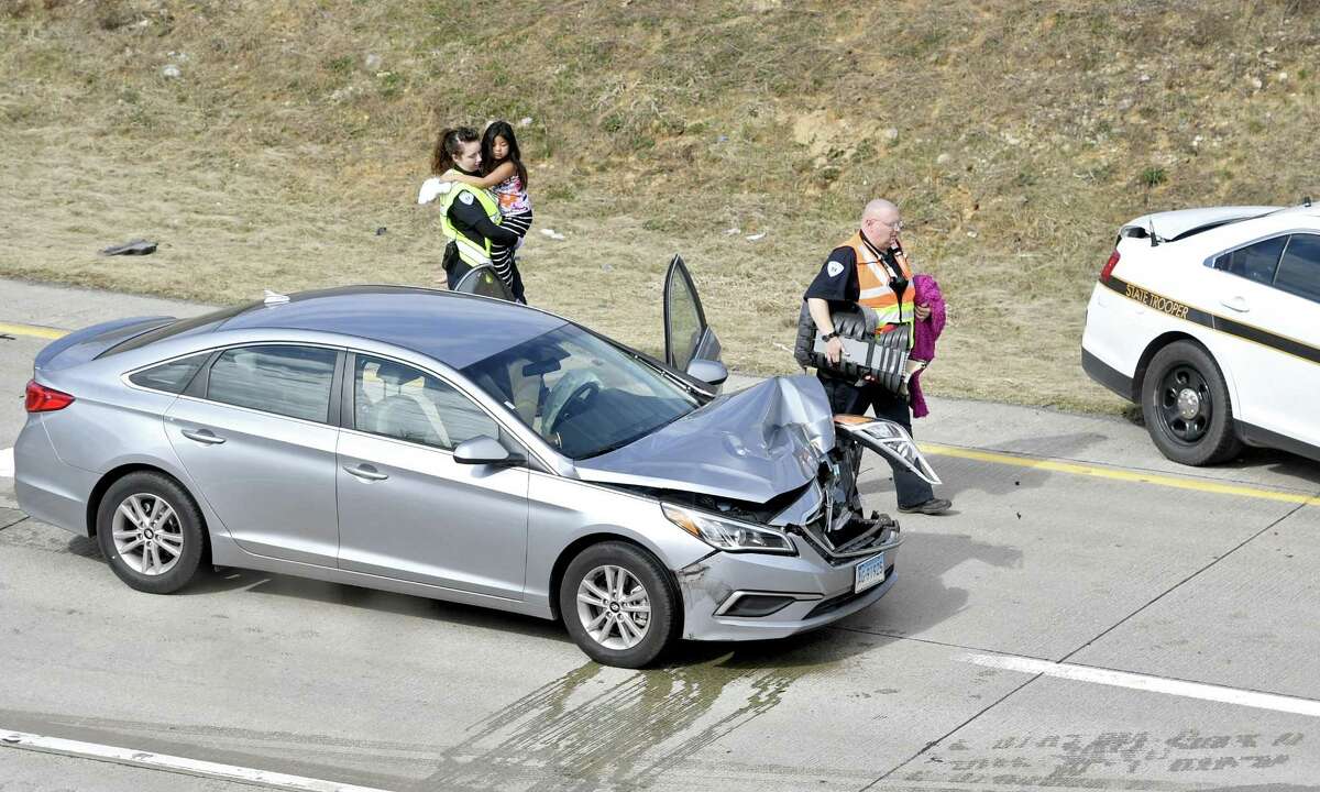 Emergency responders carry Aylin Sofia Hernandez after a high-speed pursuit with police ended with an accident on Interstate 99 northbound at the Shiloh Road interchange in Pennsylvania. The girls father, Oscar Hernandez, who was wanted for a fatal stabbing in Bridgeport, Conn., was captured at the scene.