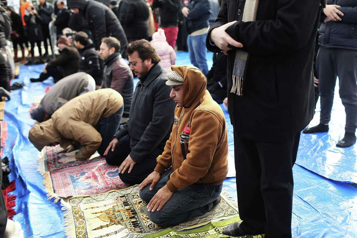 Muslim men pray at a prayer and demonstration against President Donald Trump’s travel ban. Once, it was Catholics whom many Americans feared would destroy the nation.