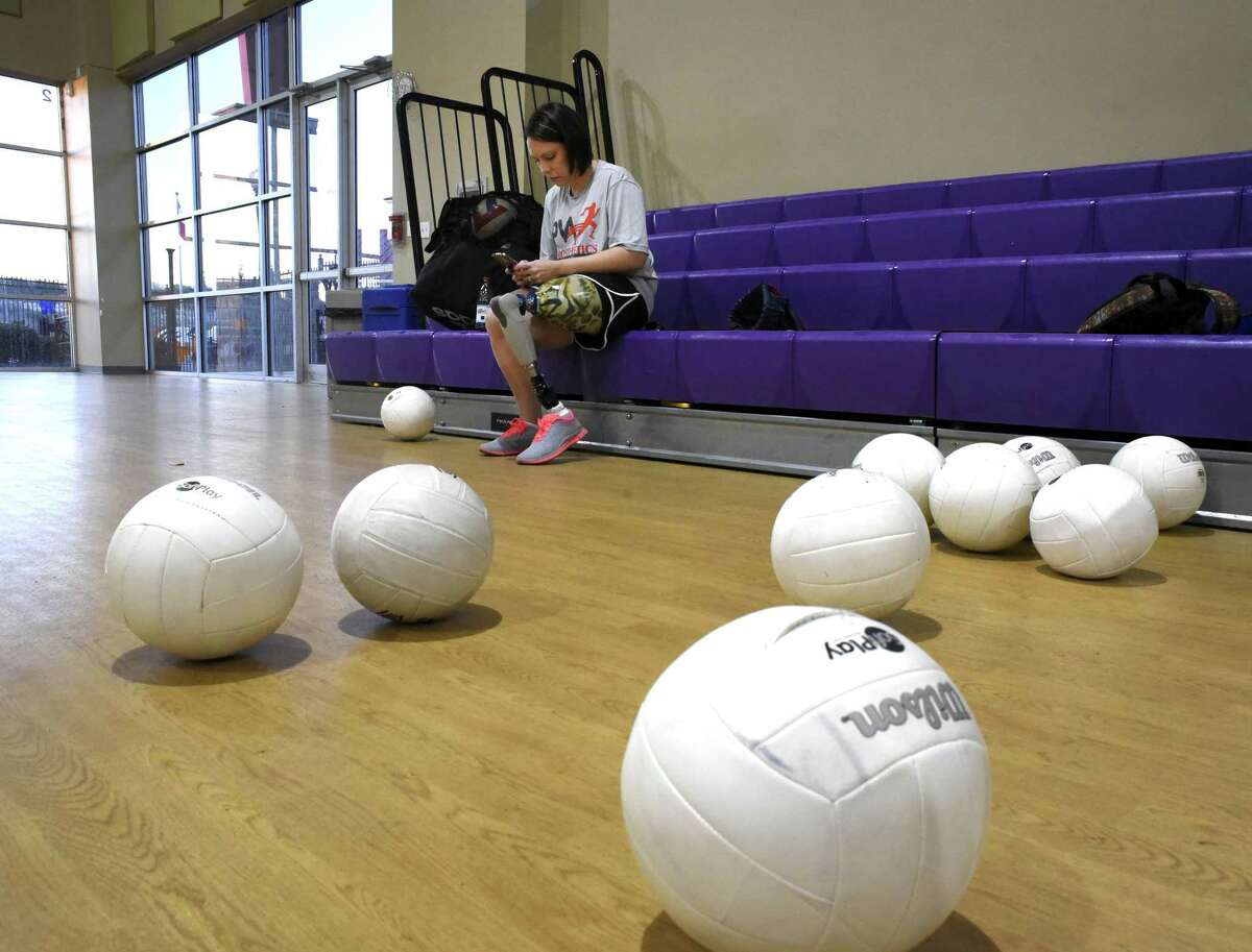 Lindsay Clark prepares for sitting volleyball practice at Morgan's Wonderland on Thursday, Feb. 23, 2017. Clark lost a leg to a birth defect.