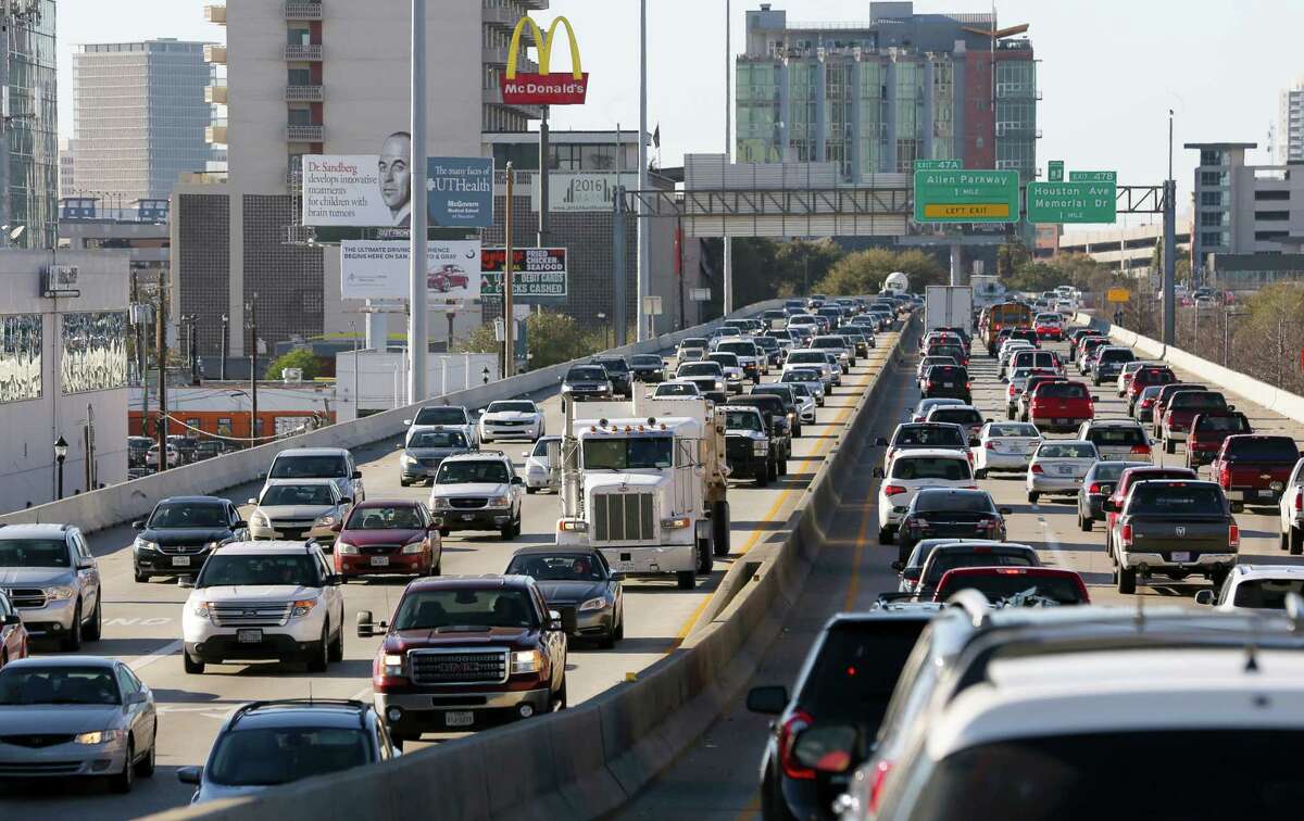 Traffic creeps along Interstate 45 where it is elevated near Pierce Street in downtown Houston on Feb. 23.