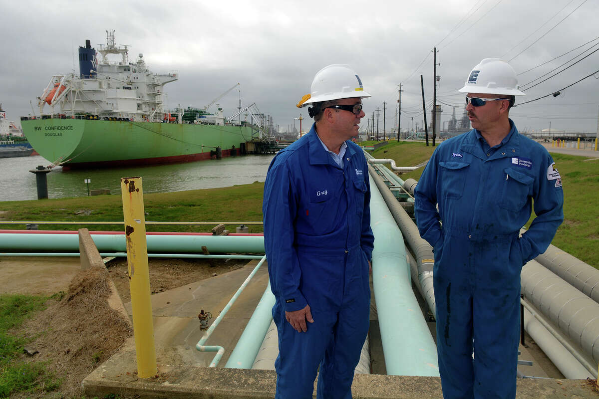 Greg DeLong, left, Enterprise Products Marine Liaison Senior Manager, and Tyson McMahon, Enterprise Products Operations Superintendent, discuss the day's schedule while in the background, a vessel is loaded with 500,000 barrels (22 million gallons) of propane at an Enterprise Products dock on the Houston Ship Channel on Feb. 10, 2017. NEXT: See major pipeline projects in Texas. 