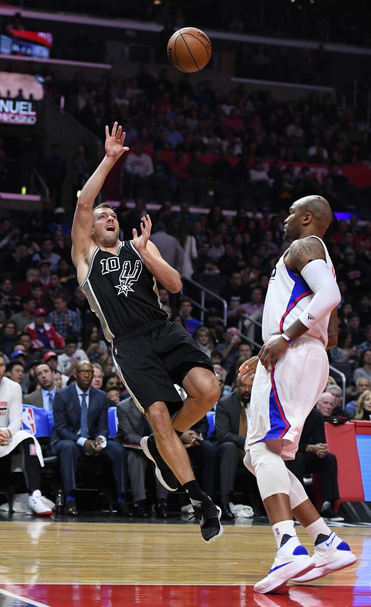 San Antonio Spurs forward David Lee, left, shoots as Los Angeles Clippers center Marreese Speights defends during the first half of an NBA basketball game, Friday, Feb. 24, 2017, in Los Angeles. (AP Photo/Mark J. Terrill)